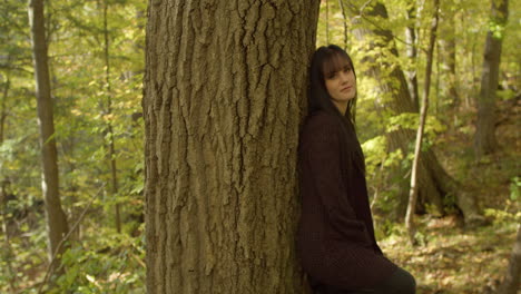 A petite, slender white girl with long straight black hair, and bangs