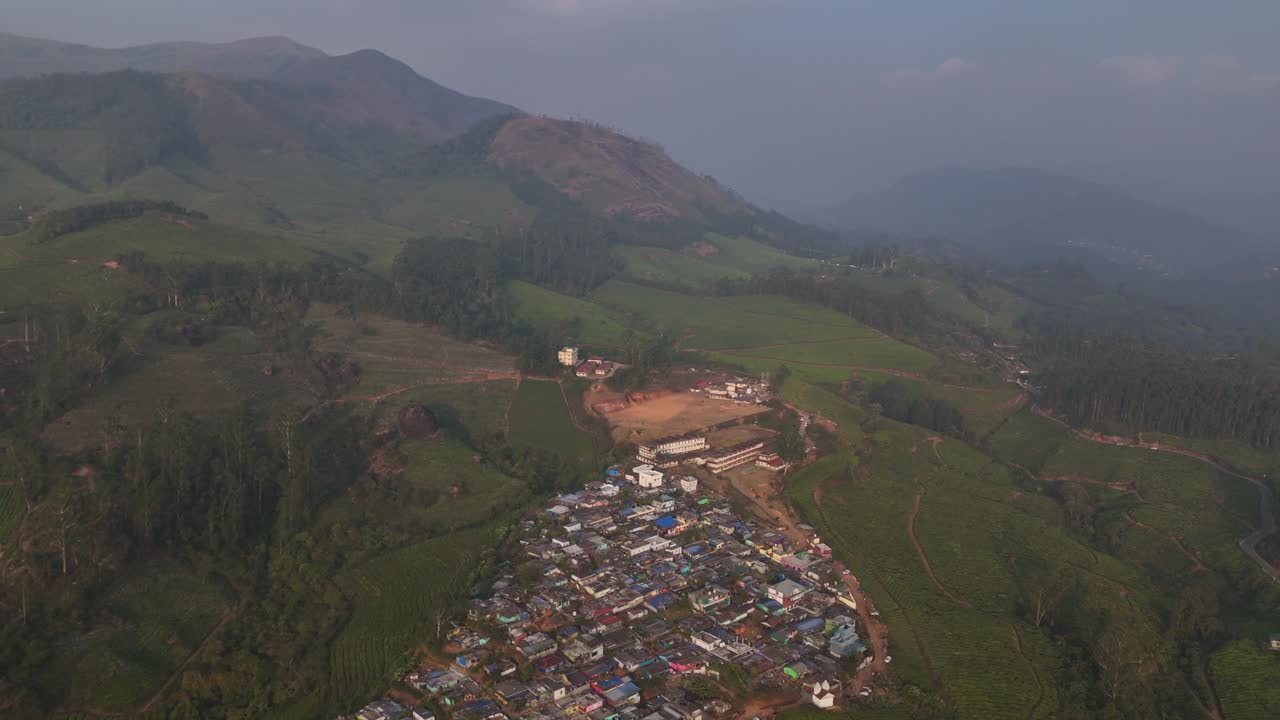 A view of a hill township , Aerial view of Tea gardens at Munnar, Kerala, India