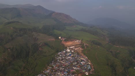 a view of a hill township , aerial view of tea gardens at munnar, kerala, india