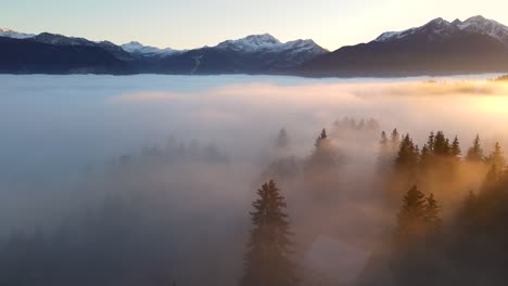 dense clouds over mountain valley at sunset