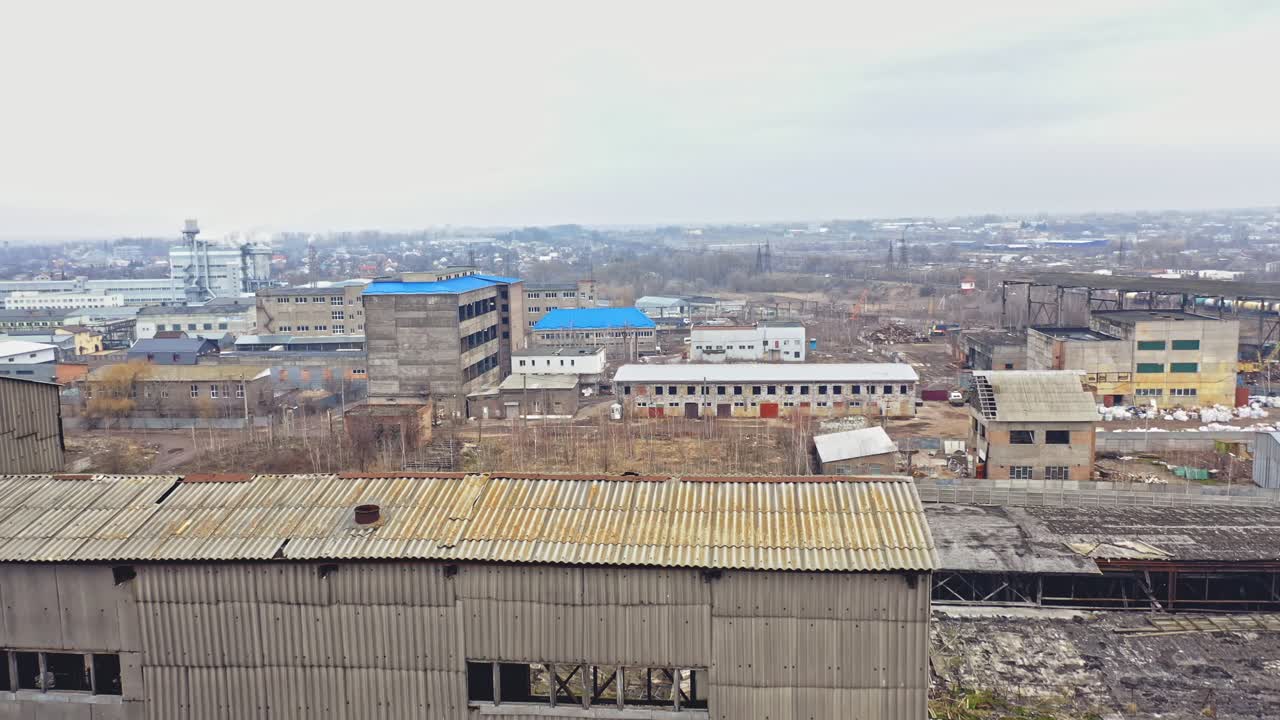 Aerial view from the air to an abandoned factory. Old industrial building for demolition.