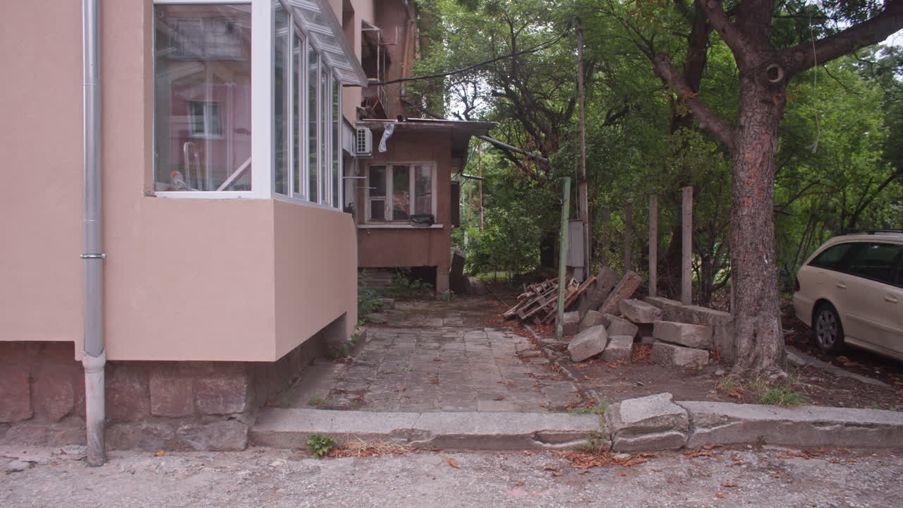 A neighborhood with communist architecture apartment buildings and the surrounding neighborhood environment, parks and trees from the communist era on the Balkans in Sofia, Bulgaria, Eastern Europe