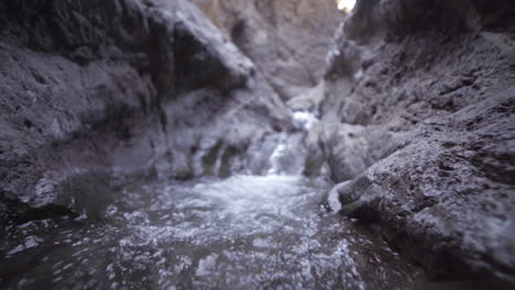 slow motion wide angle moving up rivulet waterfall
