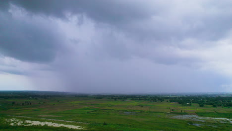 drone shot of huge plain land in nepal full of green surroundings and trees can be seen till far far apart