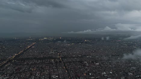 ecatepec on a cloudy day with low clouds, seen from a drone. nighttime