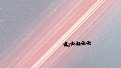 snow falling over silhouette of santa claus in sleigh being pulled by reindeers against light trails