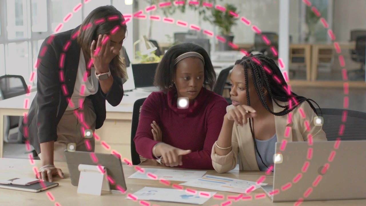 Three women in business at tablet, one pointing while pink rings rising around team, aligning data