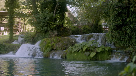 wide shot of a small backyard water stream in croatia