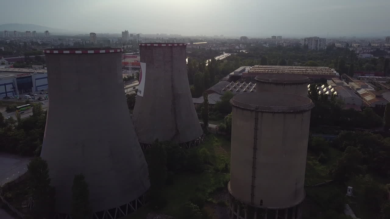 Four big chimneys of big factory in industrial zone