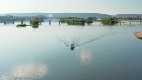 summer day aerial of boat on susquehanna river