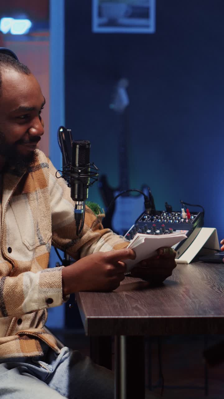 Vertical video Man recording podcast with woman, using high quality camera and professional microphones