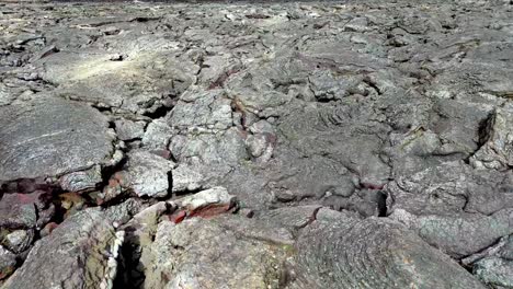 solidified lava in langihryggur iceland active volcano , aerial drone footage, rock formation geological pattern, drone close up