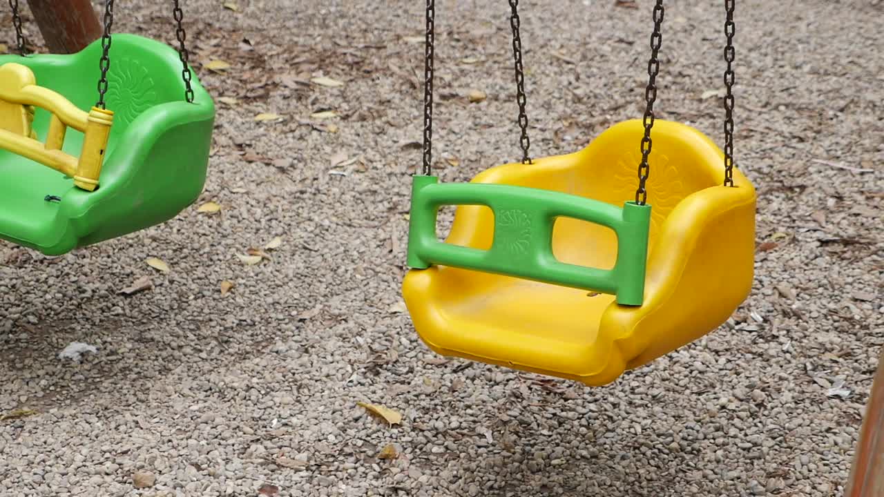 Colorful plastic swings in a playground