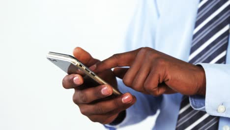 Mid-section-of-businessman-using-mobile-phone