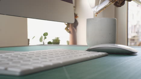 pouring coffee into a cup on the working table at home 4k