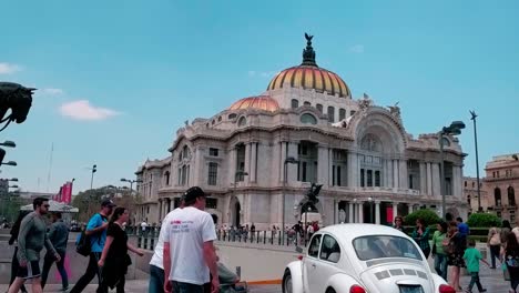 tourists visiting the plaza in front of the fine arts palace (palacio de bellas artes). mexico city.