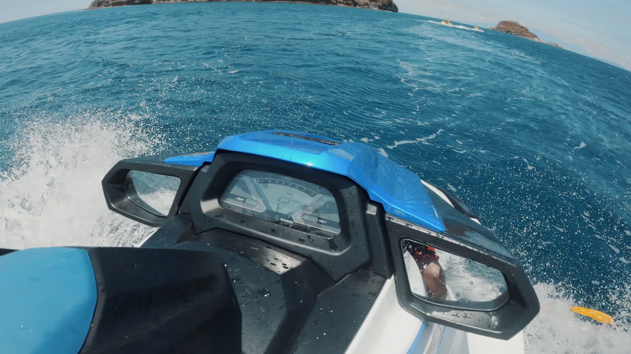 Cinematic first person shot of a jet ski ride through the clear blue ocean in the Philippines, Asia, Slomo, Slow Motion, Waverunner