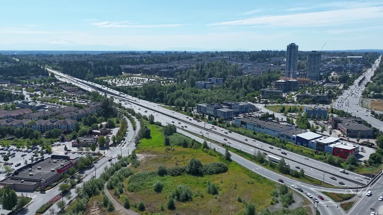 Traffic On The Highways Near Suburban Neighborhoods in Langley, BC, Canada. - aerial hyperlapse shot