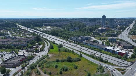 traffic on the highways near suburban neighborhoods in langley, bc, canada. - aerial hyperlapse shot