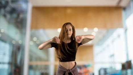 Woman-dancing-against-modern-kitchen