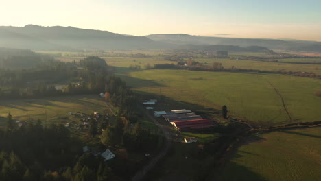 Rural-Farmland-In-Southern-Oregon,-Coquille-River-Valley,-Myrtle-Point-At-Daytime---aerial-drone-shot