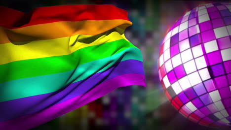 bola de discoteca girando con la bandera del orgullo gay