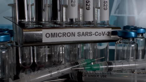 omicron sars-cov-2 test tube vials being placed into rack