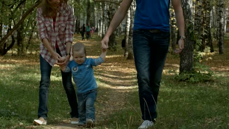 small boy running towards he's beautiful mother cheerfully