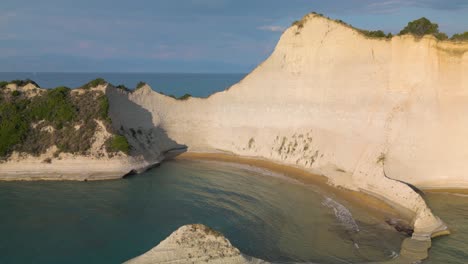 cape drastis on ionian island of corfu, greece - backwards drone shot