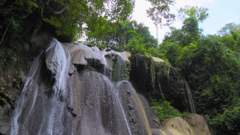 cascading waterfall in a lush green jungle
