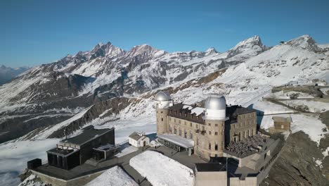 Cinematic-Drone-Shot-Above-Gornergrat-Mountain-Peak-in-Zermatt,-Switzerland