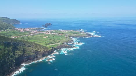 mosteiros coastline, são miguel, with dramatic cliffs and blue atlantic ocean, aerial view