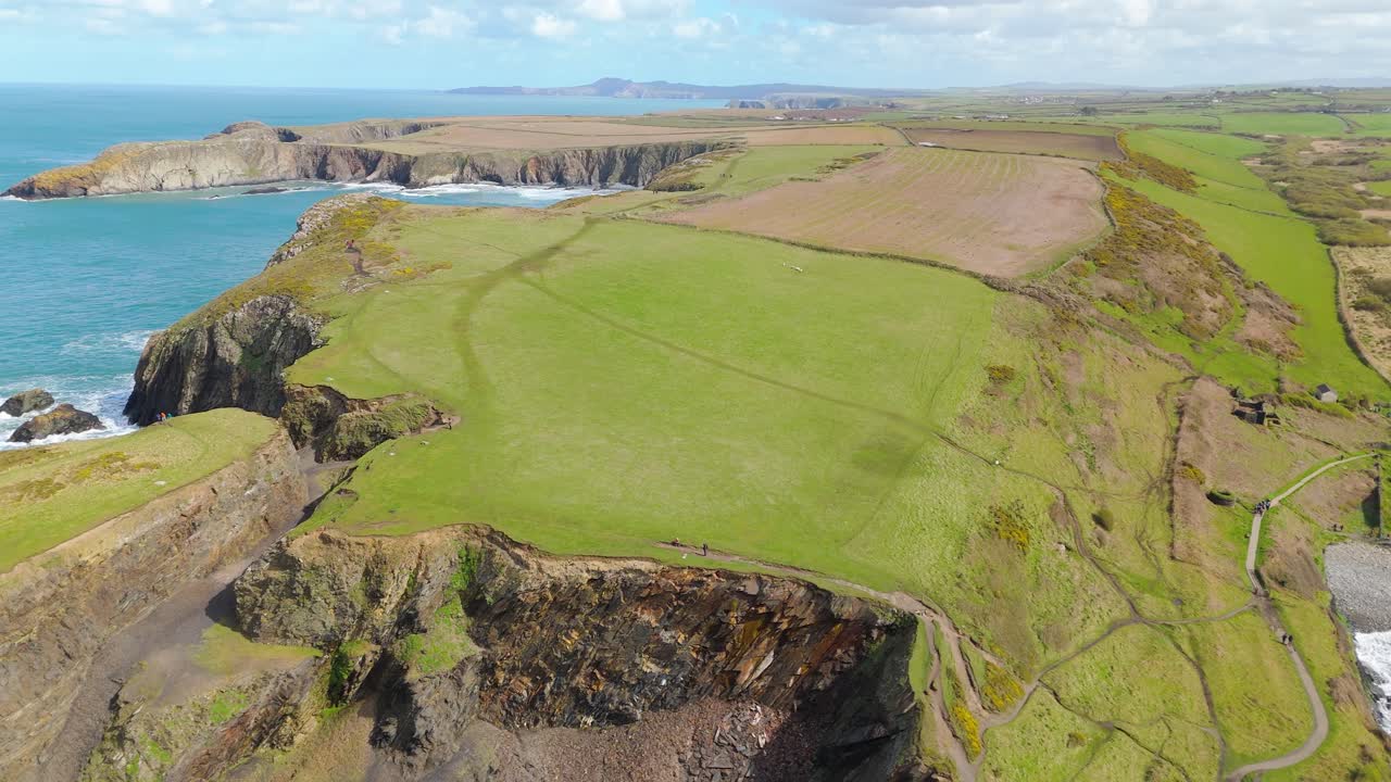 Verdant Headland Of Blue Lagoon - Abereiddi Near Pembrokeshire National Park, Wales UK. Aerial Pullback Shot