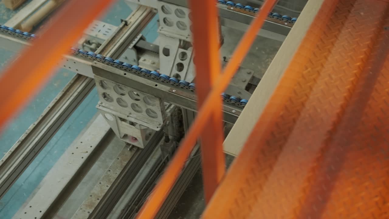 Wooden Planks Moving on an Automated Conveyor Belt in a Factory