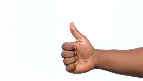 one man showing thumbs up only hand showing on white background