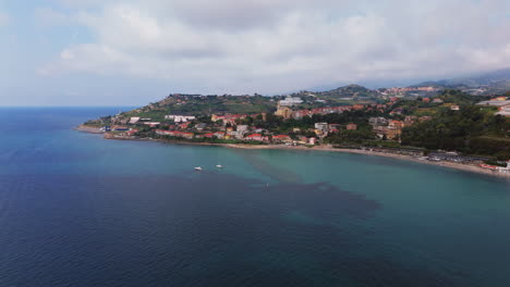 a coastal town in liguria, italy, overlooking the mediterranean sea, aerial view