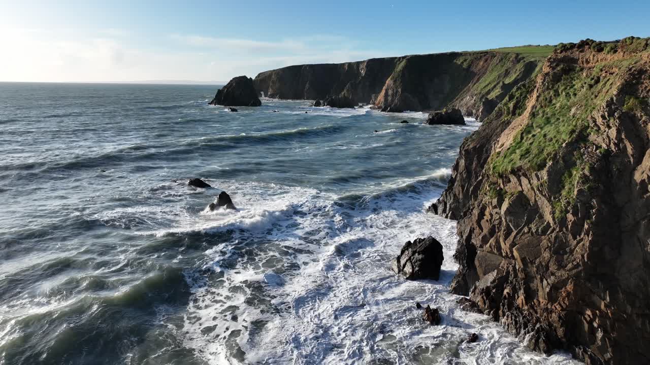 Ireland Epic locations strong sea swell waves crashing on fragile sea cliffs