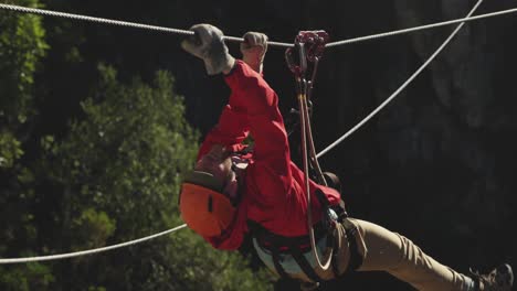 young caucasian man zip lining