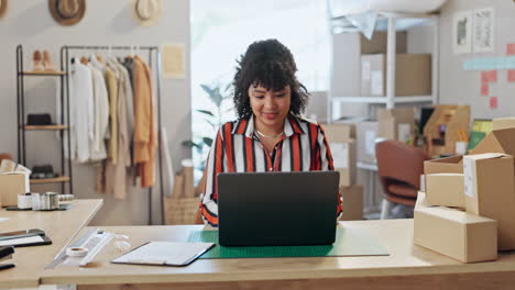 Boxes,-business-and-woman-with-a-laptop
