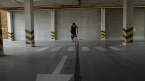 Young-man-runs-fast-inside-the-parking-garage