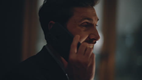 closeup mad manager screaming cellphone gesturing hands yelling at night windows