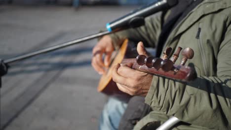 street musician playing baglama