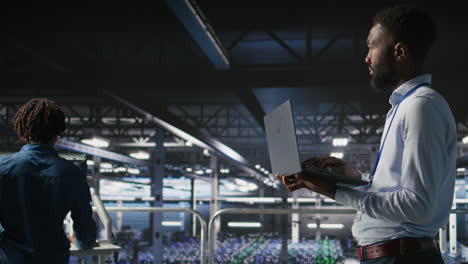 technicians on data center industrial platform analyzing performance outputs
