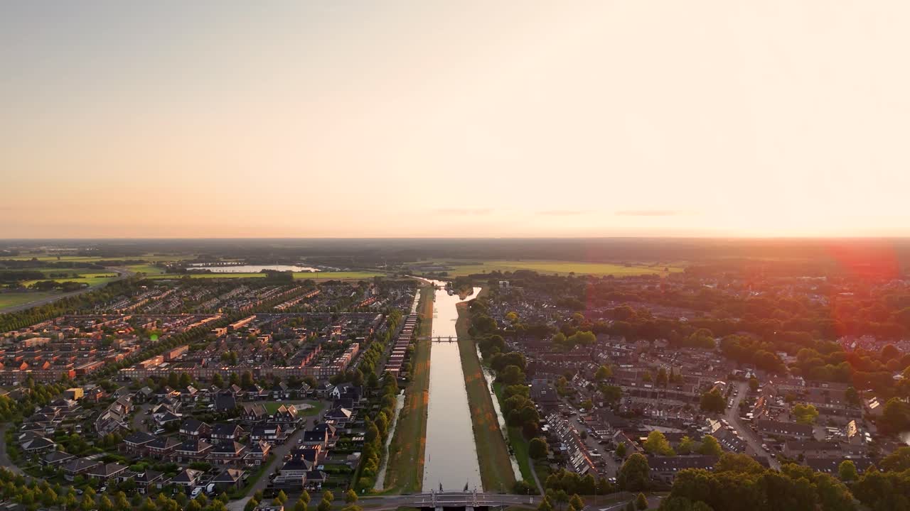 Aerial View of a Town with a Canal at Sunset