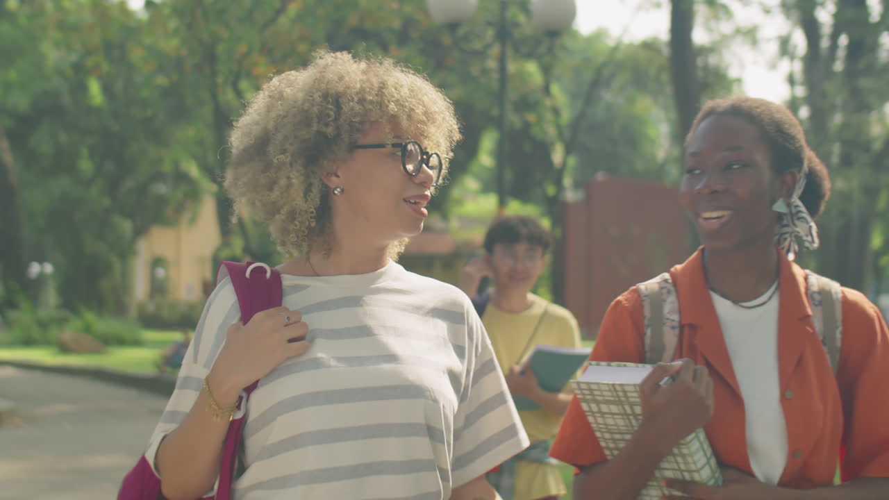 College Girls Walking in Park