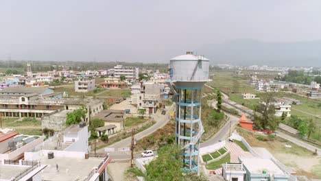 aerial view of a town with a water tower