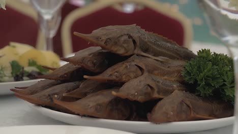 table is served with smoked sterlet