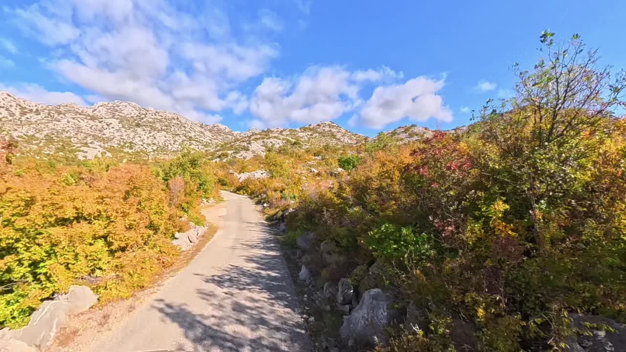 Driving along the rugged, stone-covered roads of Croatia’s Velebit mountain. Captured in crisp 4K with an Insta360 X5 POV view, autumn atmosphere, with vibrant yellow and orange leaves