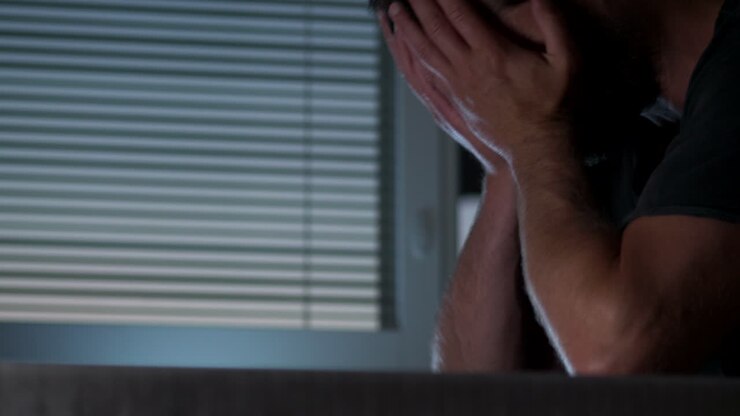 Recieved document makes person sad and anxious, close up