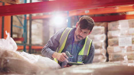 warehouse worker scanning inventory with a barcode scanner